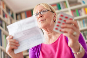 senior-woman-checking-bills-after-learning-How-to-get-a-prescription-without-insurance