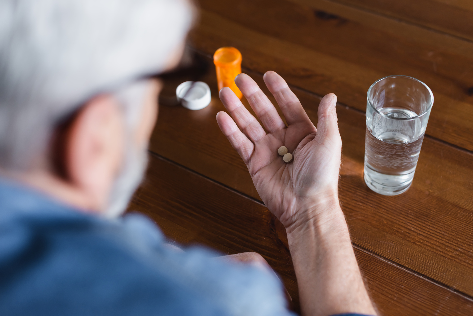 man taking mail prescription drugs