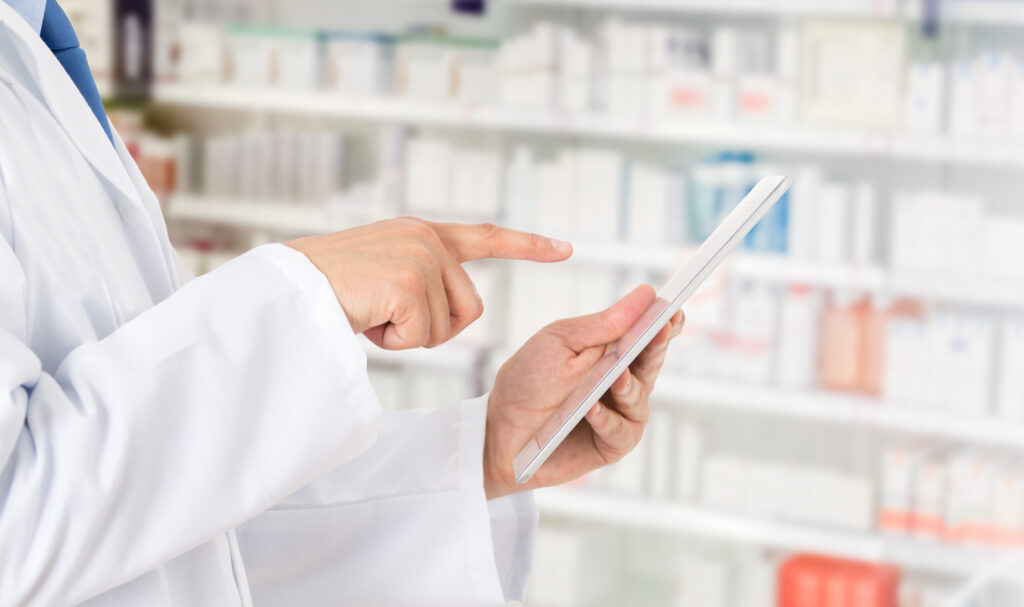 pharmacist preparing order from an online purchase of prescription drugs.