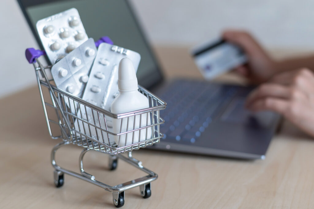 someone buying medications online to save on prescription drugs