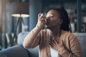 woman using affordable prescription drugs for asthma.