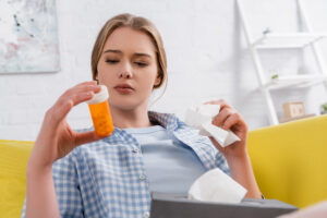 woman looking at medication from Alabama Prescription Assistance Program